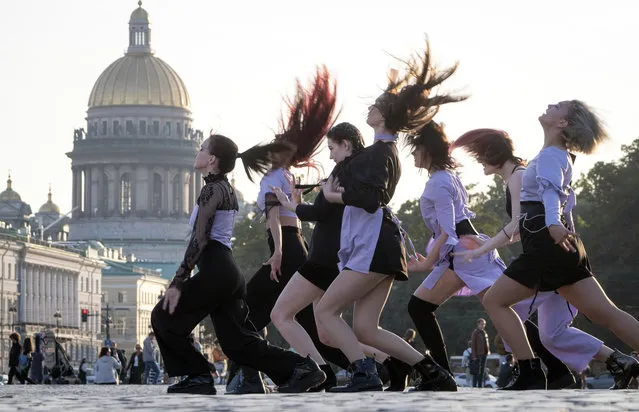 Young women dance a group dance at the Palace Square in St.Petersburg, Russia, Thursday, September 24, 2020. (Photo by Dmitri Lovetsky/AP Photo)