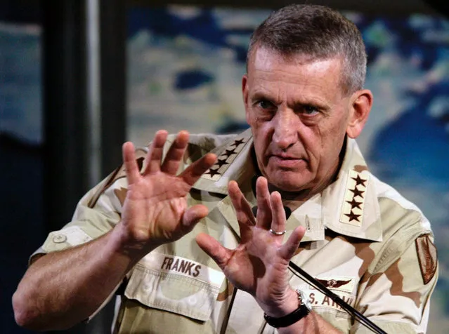 Coalition forces commander U.S. Army General Tommy Franks tells reporters that the military campaign is on track during a press conference in the media center at Camp As Sayliyah, outside Doha, Qatar, on March 30, 2003. (Photo by Tim Aubry/Reuters/The Atlantic)