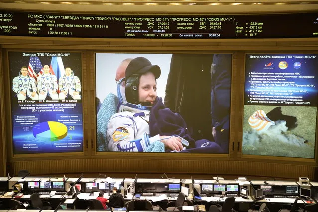 International Space Station (ISS) crew member Ivan Vagner of the Russian space agency Roscosmos is seen on the screen during a live broadcast of the landing of the Soyuz MS-16 space capsule, at the Russian Mission Control Center, in Korolyov outside Moscow, Russia  October 22, 2020. (Photo by Central Research Institute for Machine Building/Russian space agency Roscosmos/Handout via Reuters)