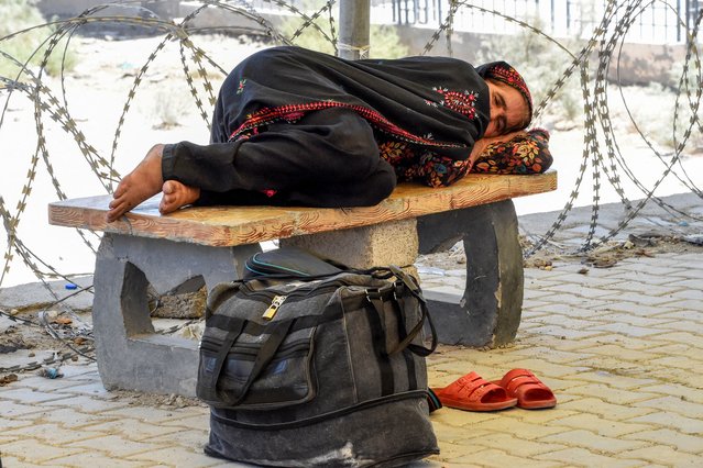 A Pakistani pilgrim who has been evacuated from Iran rests after crossing the Pakistan-Iran border at Taftan, Balochistan province, on June 18, 2025, amid the ongoing conflict between Israel and Iran. Pakistan has closed all its border crossings with neighbouring Iran for an indefinite period, provincial officials said on June 16, as Israel and Iran trade intense strikes and threaten further attacks. (Photo by Banaras Khan/AFP Photo)