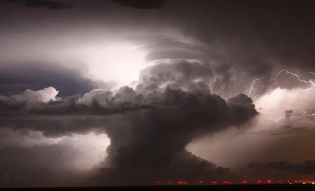 A supercell that became a Tornadic vortex signature lights up the night sky with lightning over Amarillo, Texas, May 6, 2008. (Photo by Gene Blevins/Reuters)