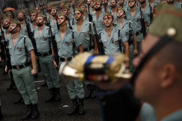 Members of La Legion, an elite unit of the Spanish Army, prepare for a military parade to celebrate a holiday known as “Dia de la Hispanidad” or Hispanic Day in Madrid, Wednesday, Oct. 12, 2016. (Photo by Daniel Ochoa de Olza/AP Photo)