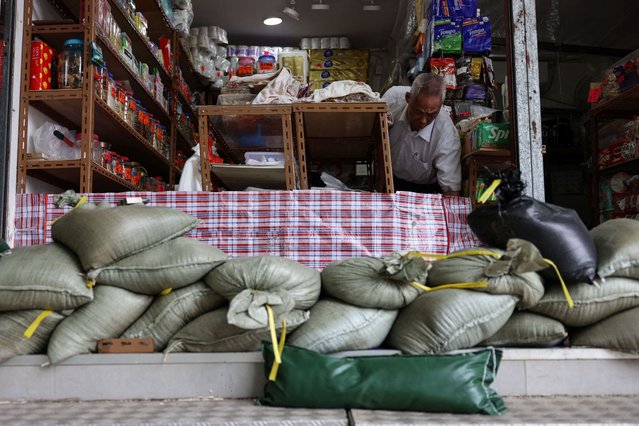 Sandbags are placed in front of a store in preparation for Super Typhoon Ragasa, in Hong Kong, China, on September 23, 2025. (Photo by Tyrone Siu/Reuters)