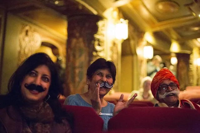 Ramesh Parekh and family watch contestants at the 2015 Just For Men National Beard & Moustache Championships at the Kings Theater in the Brooklyn borough of New York City, November 7, 2015. (Photo by Elizabeth Shafiroff/Reuters)