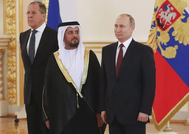 Russian President Vladimir Putin, Foreign Minister Sergei Lavrov and ambassador of the United Arab Emirates to Russia Maadhad Hareb Al Khaili attend a ceremony to receive credentials from foreign ambassadors at the Kremlin in Moscow, Russia April 11, 2018. (Photo by Sergei Ilnitsky/Reuters/Pool)