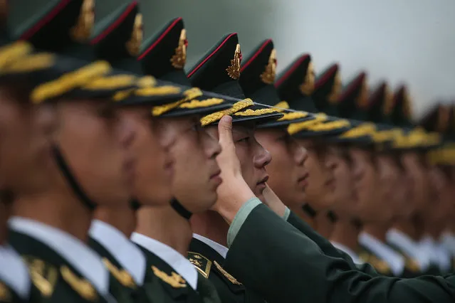 Members of People's Liberation Army honor guards rehearse ahead a welcome ceremony for Uruguayan President Tabare Vazquez at the Great Hall of the People in Beijing, China, 18 October 2016. Uruguayan President Tabare Vazquez is on an official visit to China during 12-20 October 2016. (Photo by Wu Hong/EPA)