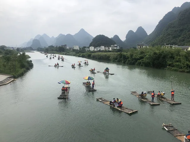 Bamboo rafting along the Yulong River in Yangshuo, China on December 16, 2020. (Photo by Sipa Asia/Rex Features/Shutterstock)