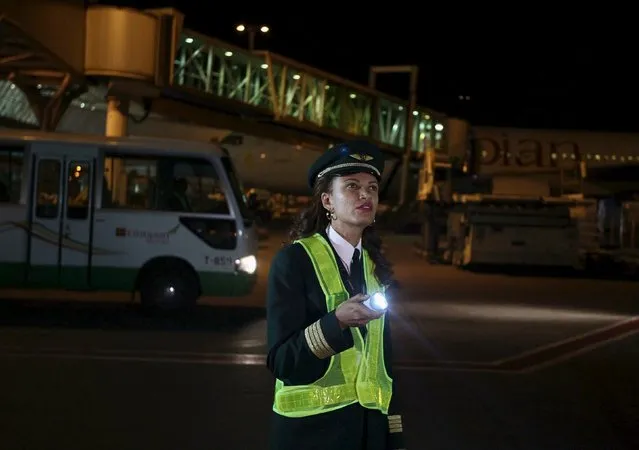 Ethiopian Airlines' first female captain Amsale Gualu checks the plane before takeoff at the Bole international airport in the capital Addis Ababa, November 18, 2015. (Photo by Tiksa Negeri/Reuters)