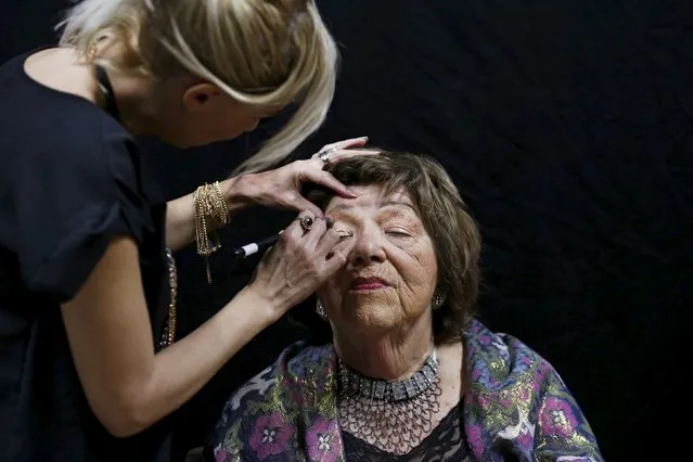 Stela Krashes, 85, (L) a Holocaust survivor, has her make-up done during preparations ahead of a beauty contest for survivors of the Nazi genocide in the northern Israeli city of Haifa, November 24, 2015. (Photo by Amir Cohen/Reuters)