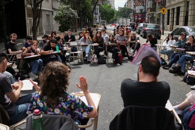 Students from the department of Philosophy and Letters at the University of Buenos Aires hold classes in the street to protest President Javier Milei's veto of a university funding law, in Buenos Aires, Argentina on October 8, 2024. (Photo by Alessia Maccioni/Reuters)