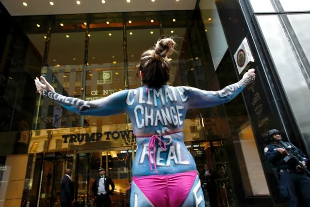 Singer Gigi Love protests against climate change outside the Trump Tower in New York, November 14, 2016. (Photo by Kena Betancur/AFP Photo)