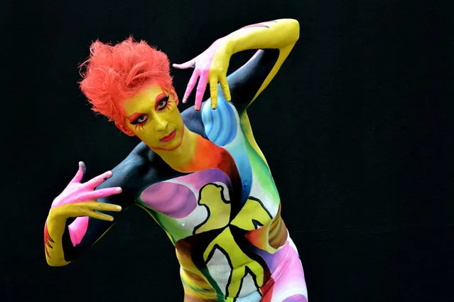 A participant poses with her body paintings designed by bodypainting artist Hyeon Jai Yoo during the 16th World Bodypainting Festival in Poertschach on July 6, 2013 in Poertschach am Woerthersee, Austria. (Photo by Didier Messens/Getty Images)