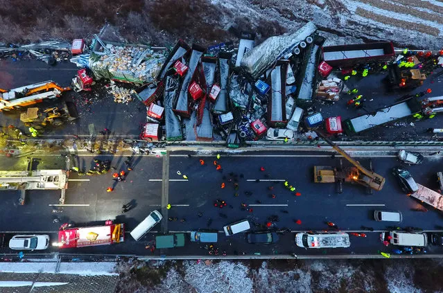 An aerial view of an accident involving 37 vehicles on the Pingyang section of the Beijing-Kunming Highway in Shanxi province, China on November 21, 2016. Four people were killed, and a further forty injured. (Photo by Xinhua News Agency/Rex Features/Shutterstock)