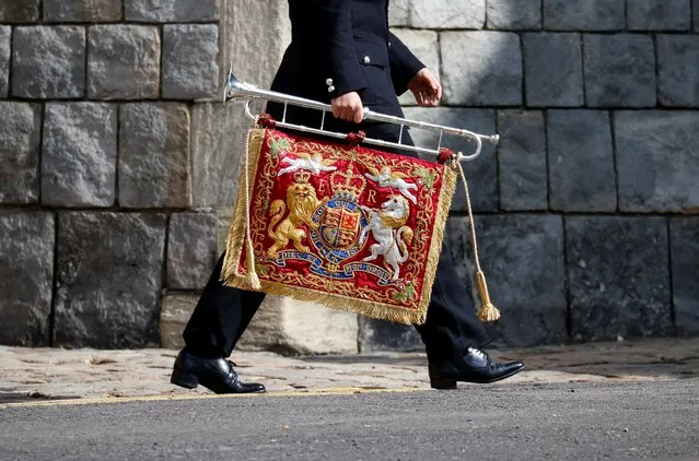 Soldier carrying a bugle with the royal coat of arms arrives at Windsor Castle, in Windsor, near London, Britain, April 16, 2021. (Photo by Phil Noble/Reuters)