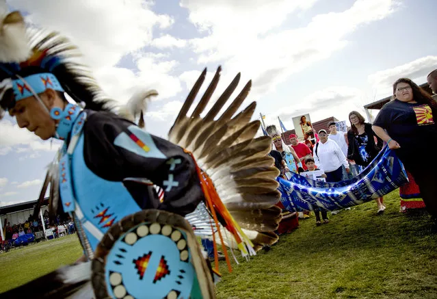 Friends and family members of Ashley HeavyRunner Loring hold a traditional blanket dance before the crowd at the North American Indian Days celebration to raise awareness and funds for her search on the Blackfeet Indian Reservation in Browning, Mont., Saturday, July 14, 2018. In January, the FBI took over the case after a tip led investigators off the reservation and into another state. A $10,000 reward is being offered in the case. (Photo by David Goldman/AP Photo)