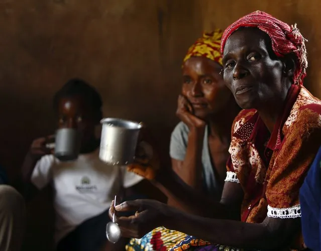 HIV-positive members of a self-help group meet with a caregiver in the village of Michelo, south of the Chikuni Mission in the south of Zambia February 23, 2015. (Photo by Darrin Zammit Lupi/Reuters)