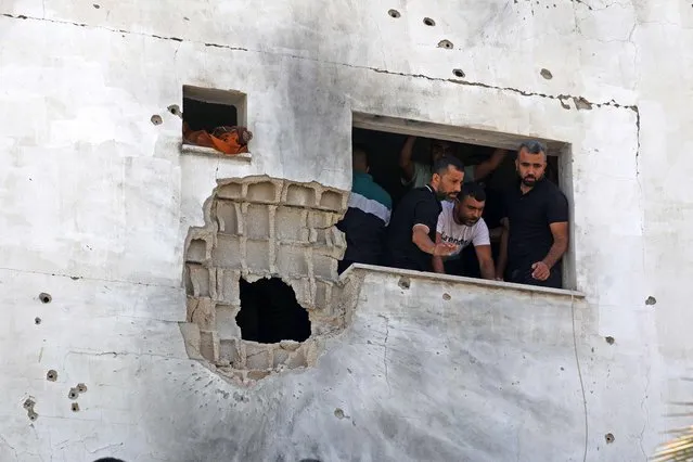 Palestinians inspect a damaged house following an Israel military raid in the Palestinian village of Aqaba, in the occupied West Bank, on September 1, 2023. (Photo by Jaafar Ashtiyeh/AFP Photo)