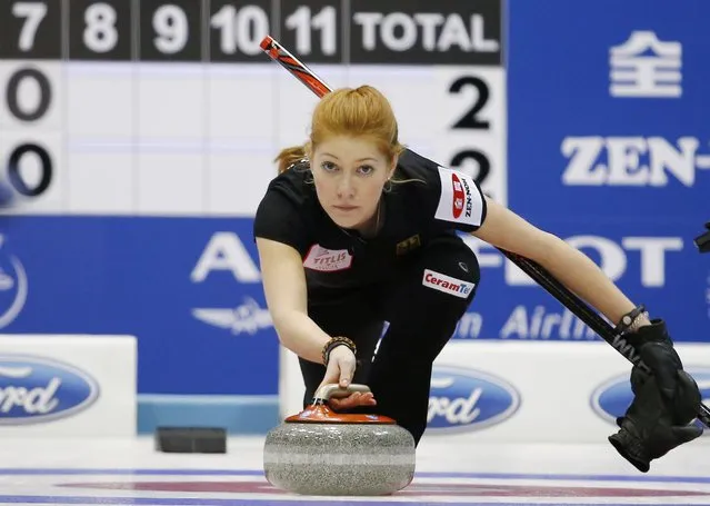 Germany's second Stella Heiss delivers a stone during her curling round robin game against Sweden at the World Women's Curling Championships in Sapporo March 14, 2015. (Photo by Thomas Peter/Reuters)