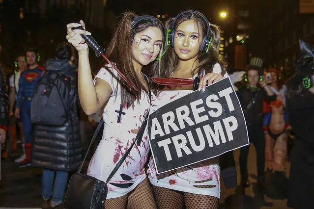 People wear political costumes to the 45th annual Village Halloween Parade in New York City on October 31, 2018. (Photo by Gordon Donovan/Yahoo News)