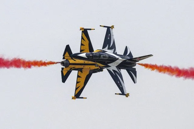 Members of South Korea's Black Eagle aerobatics team perform a display at the Seoul International Aerospace and Defense Exhibition (ADEX) in Seongnam, south of Seoul on October 18, 2023. (Photo by Anthony Wallace/AFP Photo)