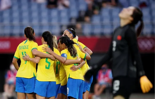 Andressinha of Brazil celebrates scoring their fourth goal with teammates as Peng Shimeng of China reactsl during the Tokyo 2020 Olympic Football Tournament match between China and Brazil at Miyagi Stadium on July 21, 2021 in Rifu, Japan. (Photo by Molly Darlington/Reuters)