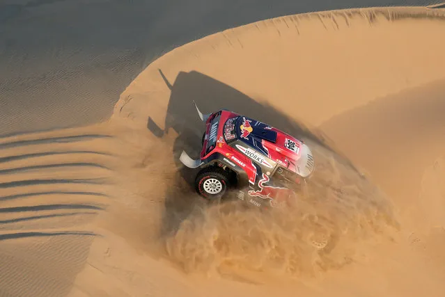 X-Raid Mini JCW's driver Stephane Peterhansel and co-driver David Castera in action during the second stage of the Dakar Rally across the dunes between Pisco and San Juan de Marcona, Peru, Tuesday, January 8, 2019. (Photo by Carlos Jasso/Reuters)