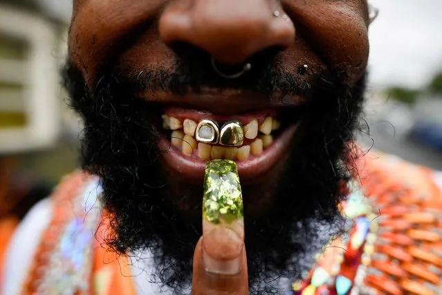 A reveller shows off his teeth after the normal Notting Hill Carnival festivities were cancelled for a second year running, amid the coronavirus disease (COVID-19) outbreak, in London, Britain, August 30, 2021. (Photo by Beresford Hodge/Reuters)
