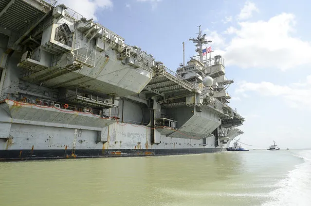 The decommissioned USS Independence is towed through the ship channel on her final voyage to the Port of Brownsville on Thursday, June 1, 2017, near Port Isabel, Texas. The ship had left Puget Sound Naval Shipyard in Bremerton, Washington, on March 11 and was towed around Cape Horn in South America to the Port of Brownsville. (Photo by Jason Hoekema/The Brownsville Herald via AP Photo)