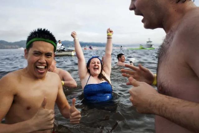 Participants react after entering Lake Washington during the Polar Bear Plunge in Seattle. (Photo by David Ryder/Reuters)