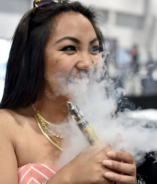 Monique Agra samples flavored vape juices at the Vape Summit 3 in Las Vegas, Nevada May 2, 2015. (Photo by David Becker/Reuters)