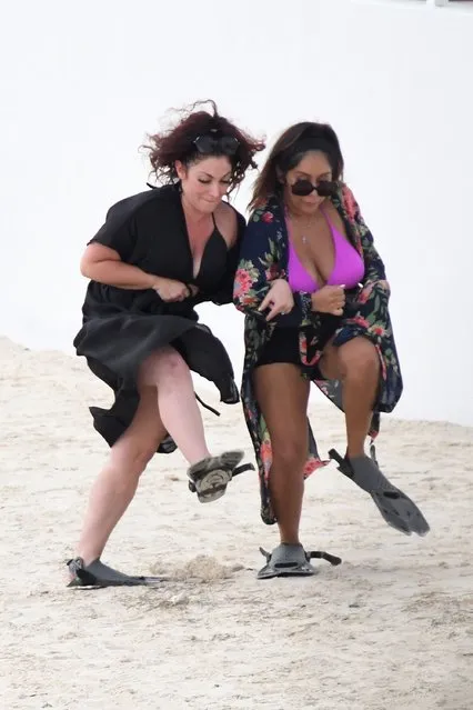 “Jersey Shore” stars Jersey Shore's “Snooki”, aka Nicole Polizzi, wears a pink bikini as she and friend Deena Cortese comically try to walk on the beach while wearing snorkeling fins on their feet while cameras roll on the laughing group of friends in the Florida Keys on November 5, 2021. (Photo by The Mega Agency)