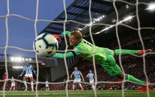 Liverpool's Sadio Mane scores their second goal as Huddersfield Town's Jonas Lossl attempts save during the Premier League match between Liverpool FC and Huddersfield Town at Anfield on April 26, 2019 in Liverpool, United Kingdom. (Photo by Jason Cairnduff/Action Images via Reuters)