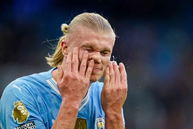 Manchester City's Erling Haaland refreshes himself during the English Premier League soccer match between Manchester City and Arsenal at the Etihad stadium in Manchester, England, Sunday, March 31, 2024. (Photo by Dave Thompson/AP Photo)
