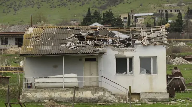 In this grab taken from Associated Press Television footage made available on Monday, April  4, 2016, a house ruined by shelling on Sunday, April 3, 2016, in the village of Mardakert, in the separatist region of Nagorno-Karabakh. (Photo by Associated Press Television via AP Photo)