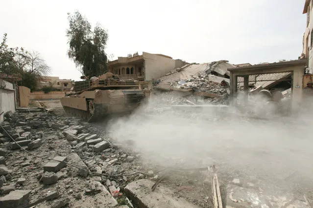 A tank from the Iraqi security forces is pictured during a battle with Islamic State militants in al-Josaq district in western Mosul, Iraq February 27, 2017. (Photo by Azad Lashkaril/Reuters)