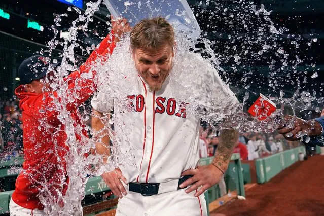 Boston Red Sox pitcher Tanner Houck is doused after throwing a three-hitter against the Cleveland Guardians in a baseball game Wednesday, April 17, 2024, in Boston. The Red Sox won 2-0. (Photo by Charles Krupa/AP Photo)