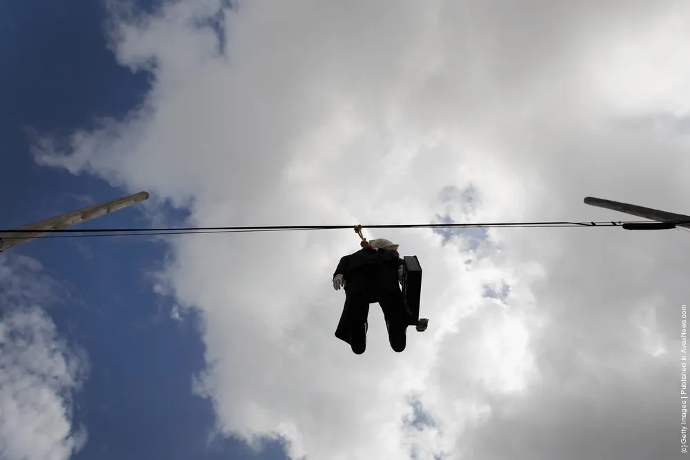Effigy Of Wall Street Banker Hangs By Freeway In Miami