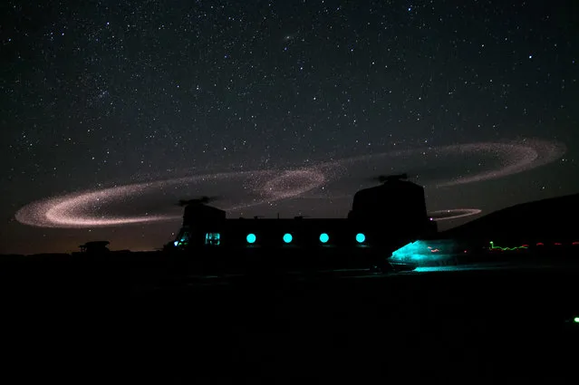 Dust lights up the rotors of a CH-47 Chinook helicopter as paratroopers with 3rd Squadron, 73rd Cavalry Regiment load for an air assault mission near Combat Outpost Ab Band May 23, 2012, Ghazni Province, Afghanistan.  The unit is part of the 82nd Airborne Division’s 1st Brigade Combat Team, which deployed to the area in March to help bring security to the areas along the country’s main road between Kabul and Kandahar. (Photo by Sgt. Michael J. MacLeod/U.S. Army)