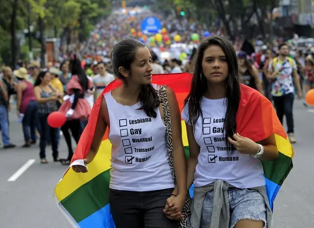 Revellers take part in a Gay Pride parade in San Jose June 28, 2015. (Photo by Juan Carlos Ulate/Reuters)