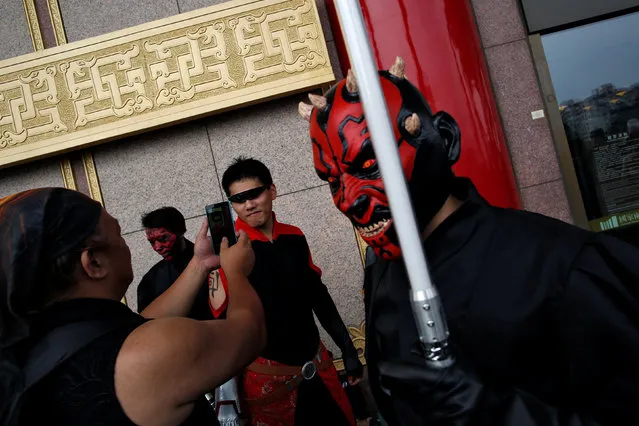 A man dressed as Darth Maul (R) from Star Wars reacts during Star Wars Day in Taipei, Taiwan, May 4, 2016. (Photo by Tyrone Siu/Reuters)