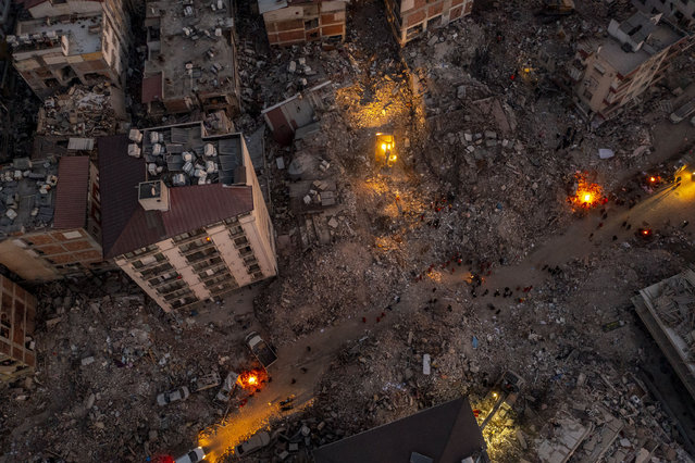 An aerial view of collapsed buildings as search and rescue efforts continue after 7.7 and 7.6 magnitude earthquakes hit multiple provinces of Turkiye including Hatay on February 13, 2023. Early Monday morning, a strong 7.7 earthquake, centered in the Pazarcik district, jolted Kahramanmaras and strongly shook several provinces, including Gaziantep, Sanliurfa, Diyarbakir, Adana, Adiyaman, Malatya, Osmaniye, Hatay, and Kilis. Later, at 13.24 p.m. (1024GMT), a 7.6 magnitude quake centered in Kahramanmaras' Elbistan district struck the region. (Photo by Ercin Erturk/Anadolu Agency via Getty Images)