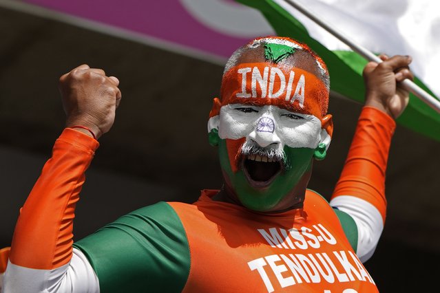 An Indian supporter cheers for his team ahead of the ICC Men's T20 World Cup cricket match between Afghanistan and India, at Kensington Oval in Bridgetown, Barbados, June 20, 2024. (Photo by Ricardo Mazalan/AP Photo)