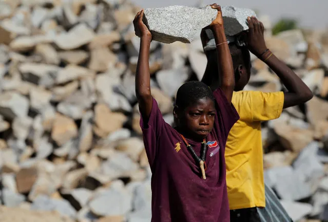 Children carry pieces of rock at a granite crushing plant near a gold mine in Zamfara, Nigeria,  April 21, 2016. (Photo by Afolabi Sotunde/Reuters)