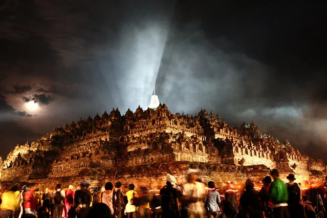 A view of Borobudur temple is illuminated during Vesak Day, commonly known as “Buddha's birthday”, at the Borobudur Mahayana Buddhist monument on May 28, 2010 in Magelang, Central Java, Indonesia. (Photo by Ulet Ifansasti/Getty Images)
