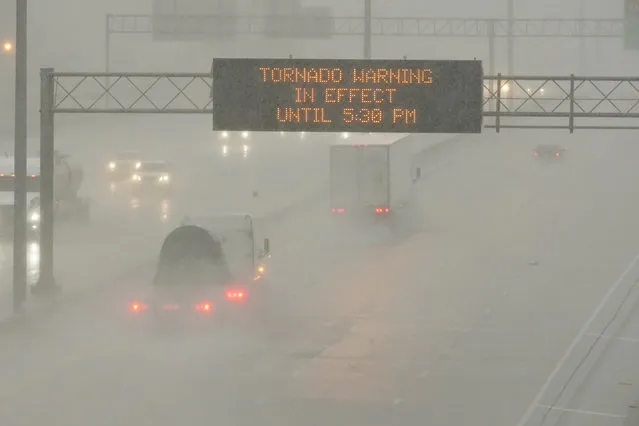 The Mississippi Department of Transportation digital message board warns drivers along I-55 southbound in Jackson of a tornado warning during a rainstorm during the outbreak of severe weather in the state, Wednesday, March 30, 2022. (Photo by Rogelio V. Solis/AP Photo)