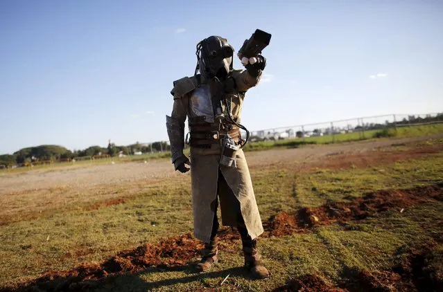 A cosplay enthusiast poses as Diesel Punk soldier of the Mad Max film during the “Anime Friends” annual event in Sao Paulo July 19, 2015. (Photo by Nacho Doce/Reuters)