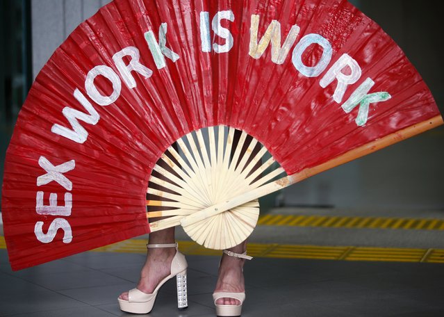 An activist representative of sеx workers holds a sign during a demonstration calling for the legalization of prostitution at the Ministry of Social Development and Human Security in Bangkok, Thailand, 13 June 2024. The Thai government has pledged to legalize the prostitution after the Ministry of Social Development and Human Security drafted a bill to protect s*x workers and regulate the profession in a bid to save sеx workers from being exploited. In Thailand sеx workers were fighting for their basic and occupational rights protection for decades but under the 1996 Prevention and Suppression of Prostitution Act which enforced sеx work a crime. (Photo by Rungroj Yongrit/EPA/EFE)