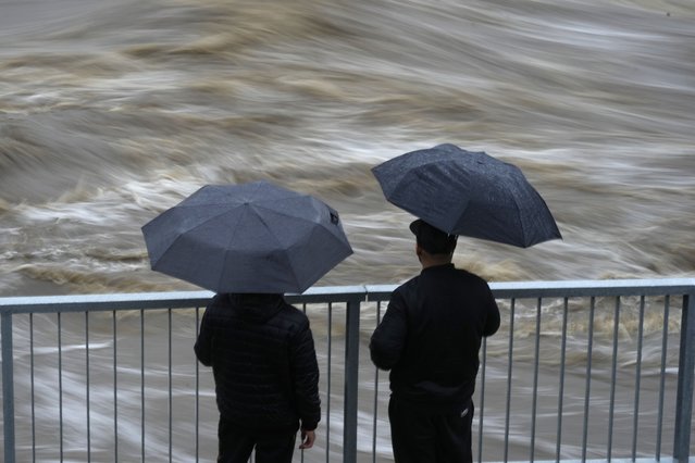 Residents watch the flow of the Bela River during floods in Mikulovice, Czech Republic, Saturday, September 14, 2024. (Photo by Petr David Josek/AP Photo)