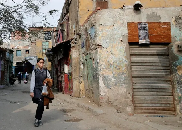 A girl walks by old houses and shops at Manshiet Nasser shanty town in the capital Cairo, Egypt February 13, 2017. (Photo by Amr Abdallah Dalsh/Reuters)
