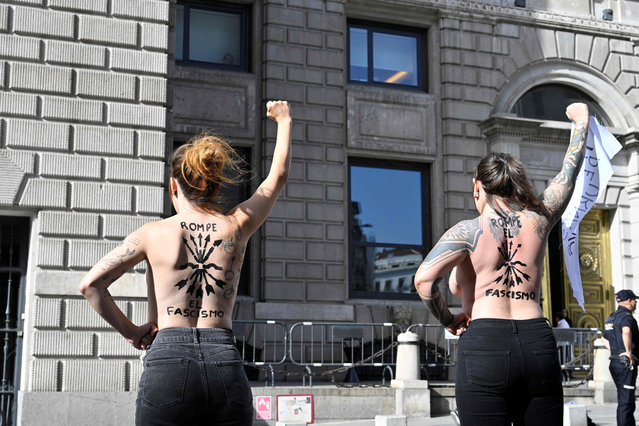 Femen activists protest in front of the Electoral Commission in Madrid on July 11, 2023 against the use by Spain's fascist Falange party of the fascist hymn “Cara al Sol” in its electoral campaign, ahead of July 23 general election. (Photo by Javier Soriano/AFP Photo)